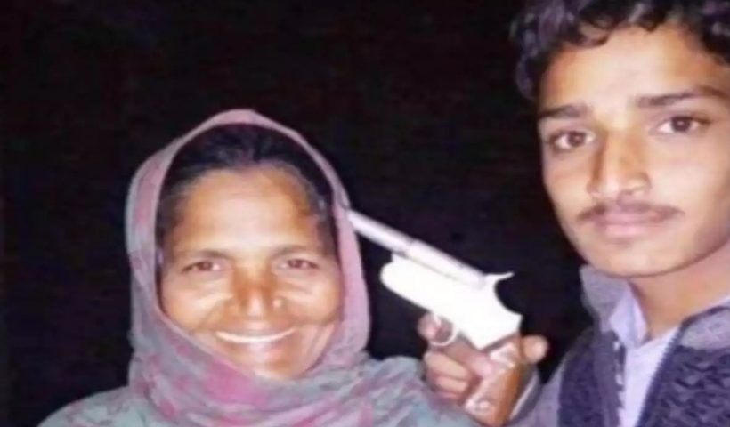 Youth poses with gun at his mother's head