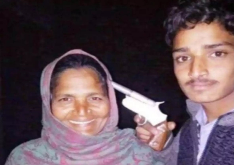 Youth poses with gun at his mother's head