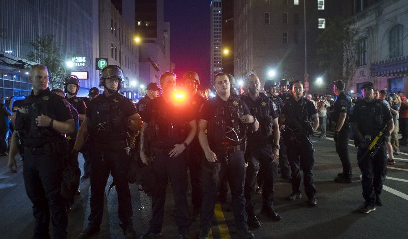 Police stand guard during a demonstration in Tulsa