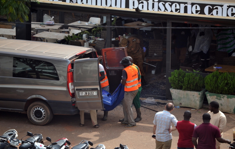 OUAGADOUGOU, Aug. 14, 2017 (Xinhua) -- Rescuers transfer remains of the victims of an attack at a restaurant in Ouagadougou, capital of Burkina Faso, on Aug. 14, 2017. A group of gunmen attacked a Turkish restaurant in the center of Burkina Faso on Sunday evening, leaving at least 18 dead and 20 others injured