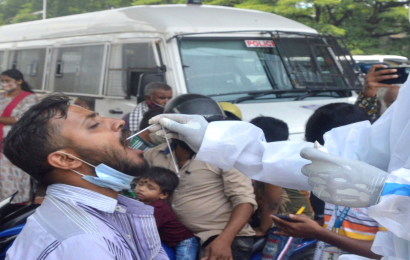 Health workers collect swab samples for COVID 19 tests