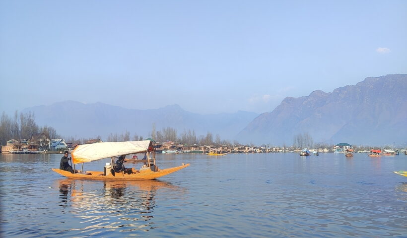 A boatman rows his shikara at Dal Lake in Srinagar
