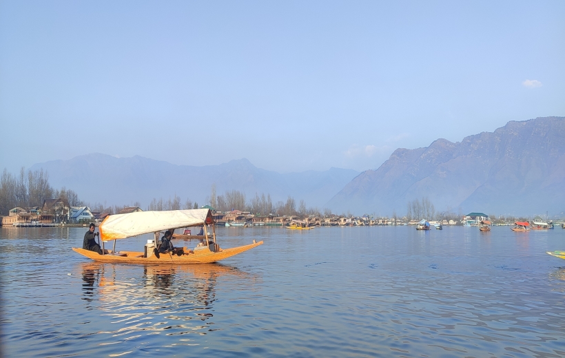 A boatman rows his shikara at Dal Lake in Srinagar