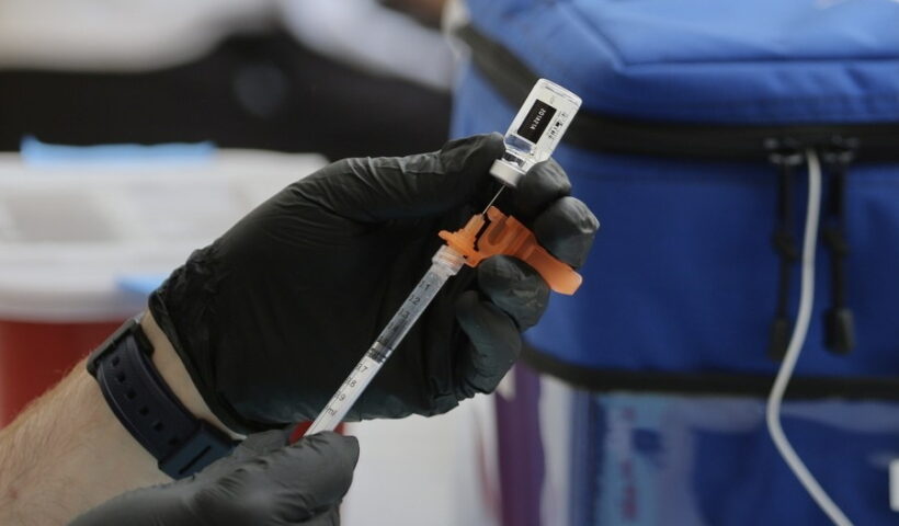 A medical worker prepares the COVID-19 vaccines for local residents at the COVID-19 vaccination clinic in Pasadena, Los Angeles County, California, the United States