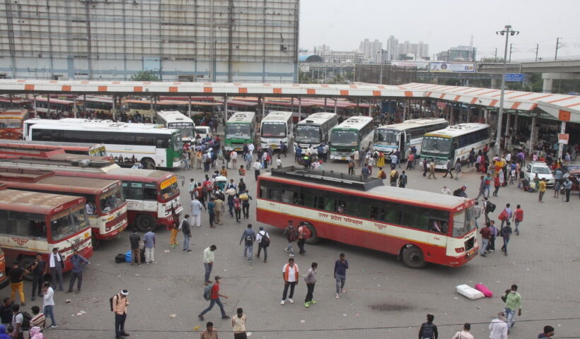 Large numbers of migrants at Kaushambi bus stand to board buses for their native place