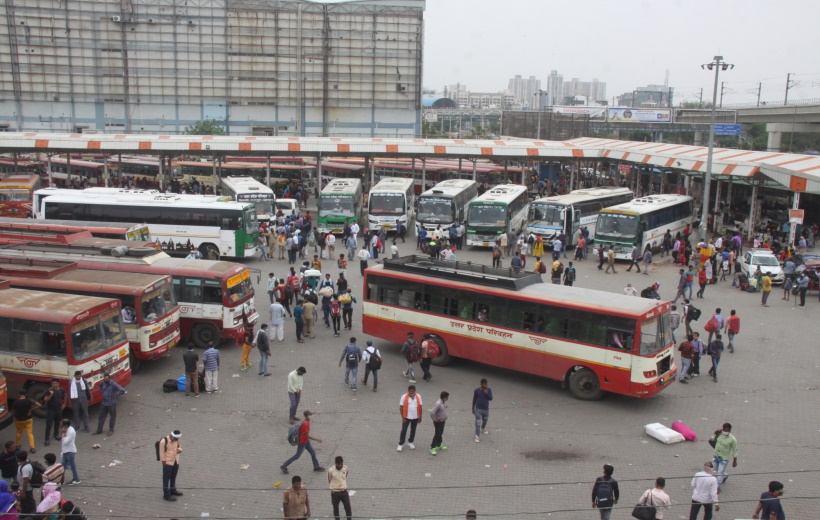 Large numbers of migrants at Kaushambi bus stand to board buses for their native place