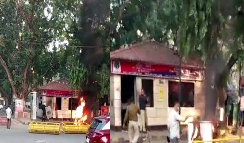 Man sets his bike on fire, breaks window panes of police post in Delhi's Khan market.