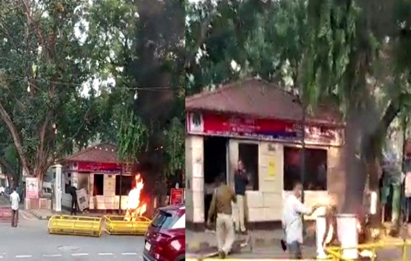 Man sets his bike on fire, breaks window panes of police post in Delhi's Khan market.