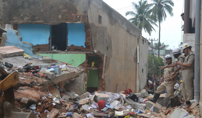 Fire brigade carry out rescue operations at the site where at least three persons were killed in a gas cylinder blast that shattered a residential building in Bengaluru's southern suburb on