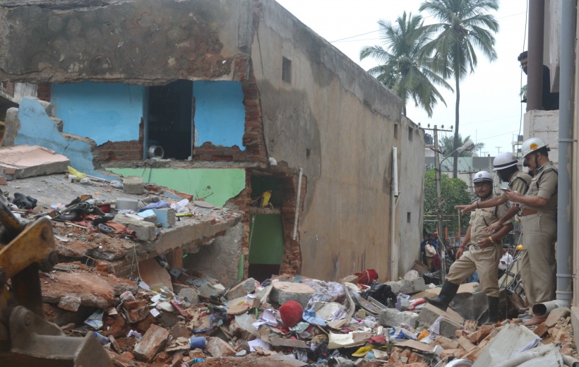 Fire brigade carry out rescue operations at the site where at least three persons were killed in a gas cylinder blast that shattered a residential building in Bengaluru's southern suburb on