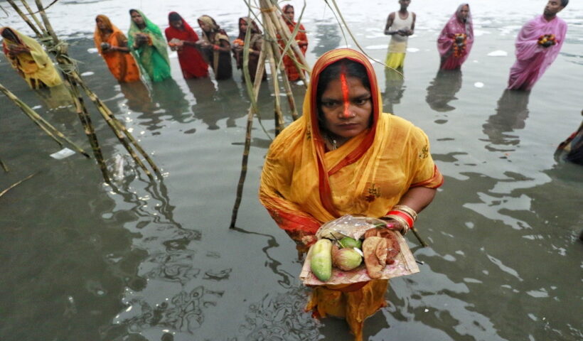 Delhi: Devotees perform rituals in the Yamuna river, covered by chemical foam caused due to industrial and domestic pollution