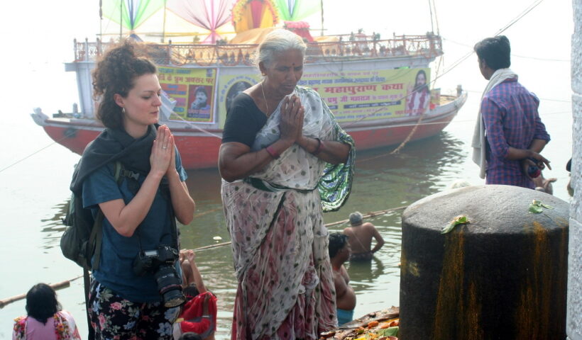 Varanasi: A foreign tourist worship lord Shiva linga on the eve of the Maha Shivaratri on the banks of ganga in Varanasi
