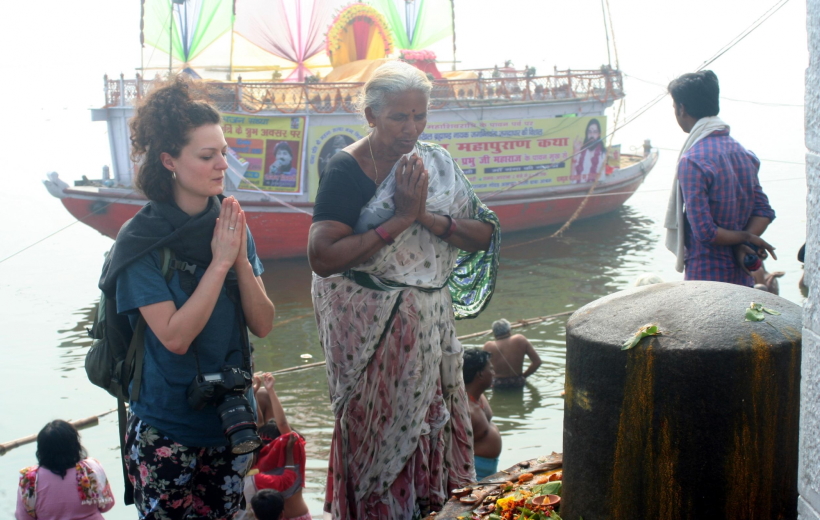Varanasi: A foreign tourist worship lord Shiva linga on the eve of the Maha Shivaratri on the banks of ganga in Varanasi