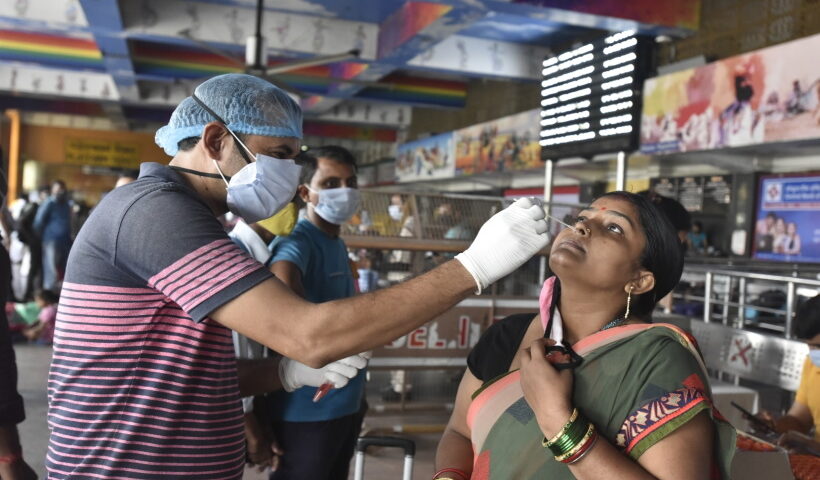 New Delhi: Swab tests to passengers arriving at the New Delhi Railway Station from their native, after the Delhi government eased restrictions for travel amid the ongoing Coronavirus pandemic