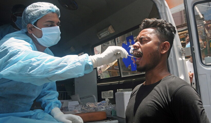 Kolkata: A health worker collects a swab sample from a man for Covid-19 test amid the surge in coronavirus cases
