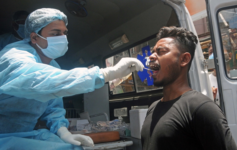 Kolkata: A health worker collects a swab sample from a man for Covid-19 test amid the surge in coronavirus cases
