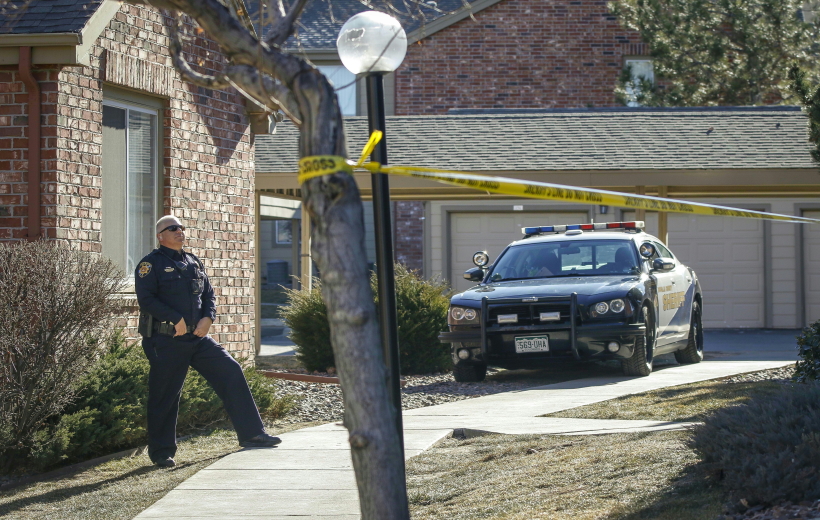 A policeman secures a suburban Denver apartment building where the shooting of several sheriff's deputies took place in Highlands Ranch, Colorado, the United States, on Jan. 2, 2018. One deputy was killed and four officers were injured after they were being called to respond to a domestic disturbance last Sunday morning at a Colorado apartment complex. (Xinhua/Marc Piscotty/IANS)