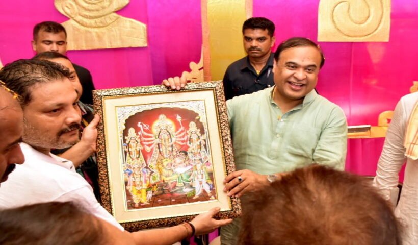 Assam Chief Minister Himanta Biswa Sarma being presented a memento as he visits to offer prayers at Durga Puja Pandal in Karimganj