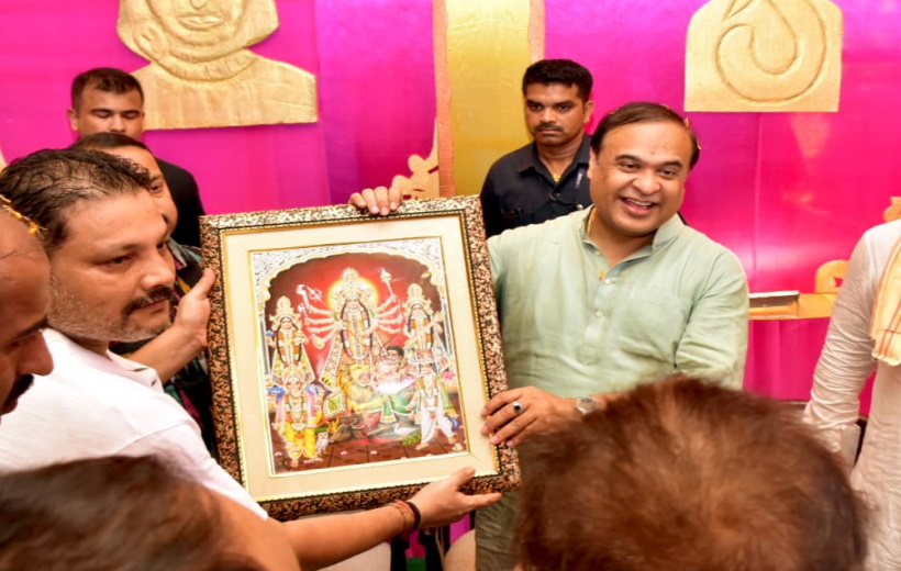 Assam Chief Minister Himanta Biswa Sarma being presented a memento as he visits to offer prayers at Durga Puja Pandal in Karimganj