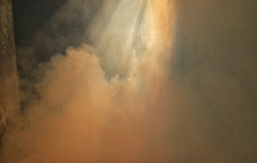 A worker of the Municipal Corporation of Delhi lights a lamp in Delhi as a precaution against the spread of dengue,