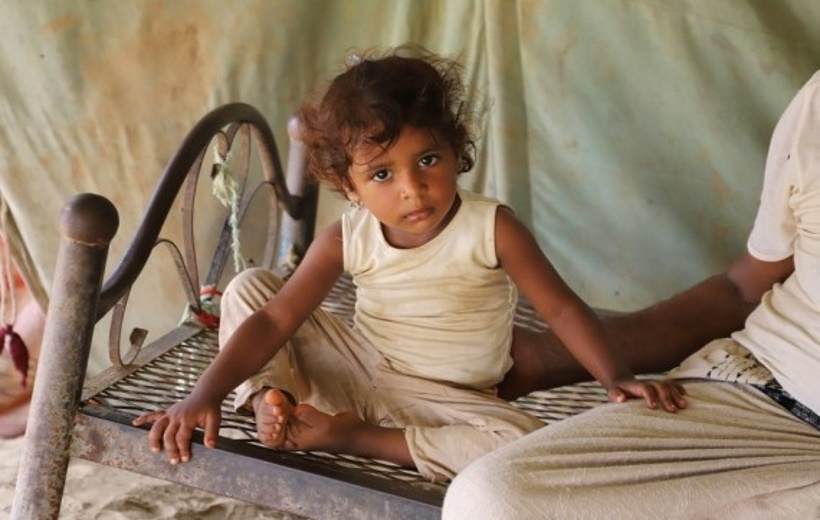 A girl sits on the bed in a remote village in Midi District, Hajjah Province, north Yemen on Aug