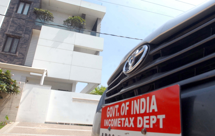 Tax Department parked outside the residence of Congress