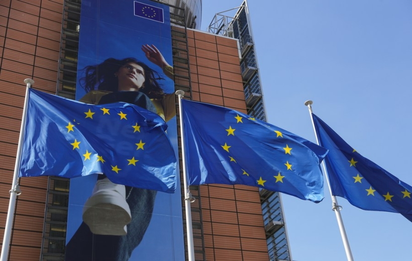 European Union flags fly outside the European Commission building in Brussels,