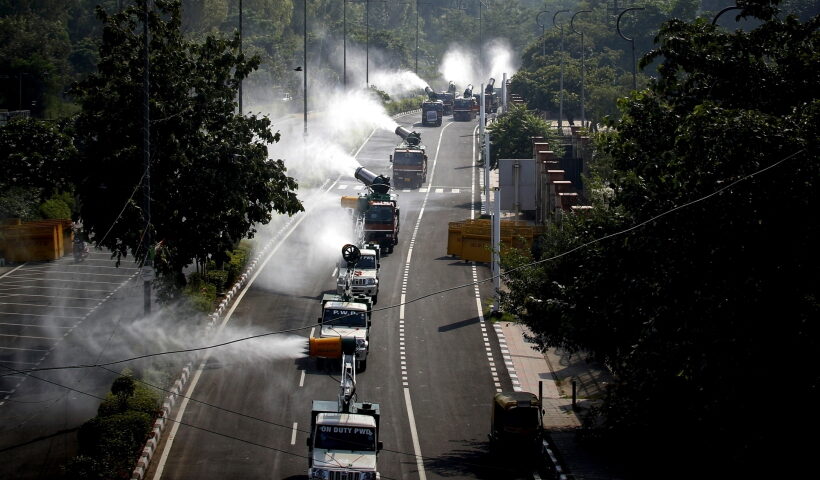 New Delhi: Mobile Anti-Smog Guns vehicles sprinkle water on a road to control pollution Municipal Corporation of Delhi