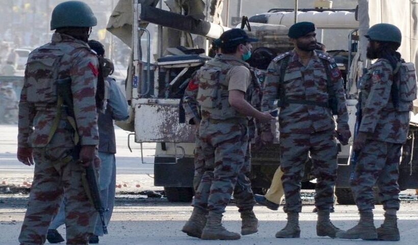 Security personnel examine the blast site in southwest Pakistan's
