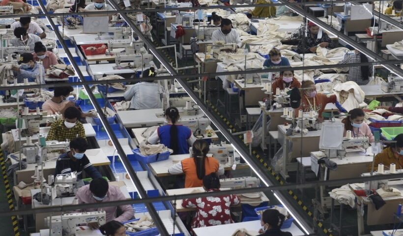 Garment workers make clothes at a factory in Phnom Penh, Cambodia.