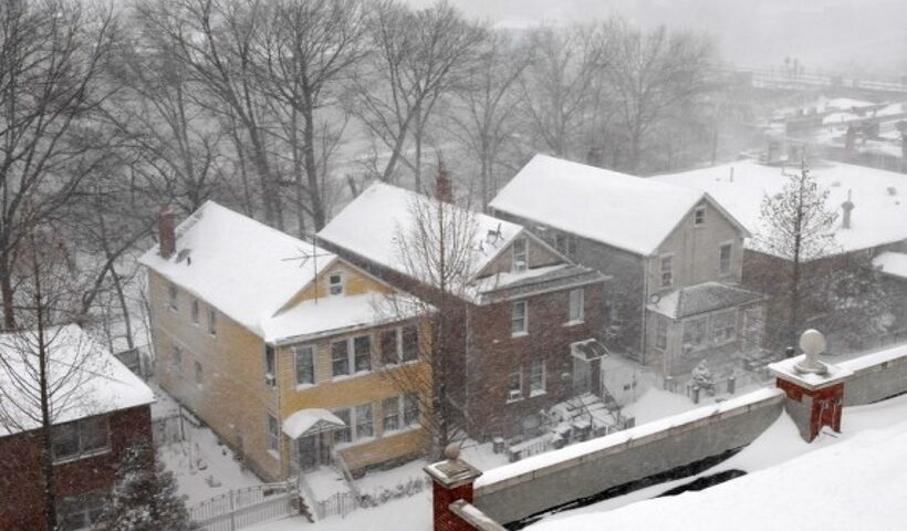 Photo taken on Feb. 1, 2021 shows snow-covered buildings in New York, the United States