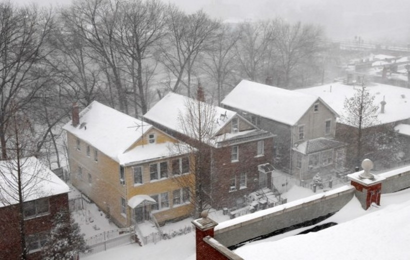 Photo taken on Feb. 1, 2021 shows snow-covered buildings in New York, the United States