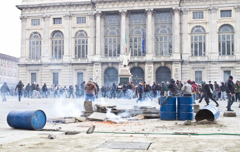 Protestors clash with policemen during the demonstration in Torin, Italy on Dec. 9, 2013. Striking workers and truckers c