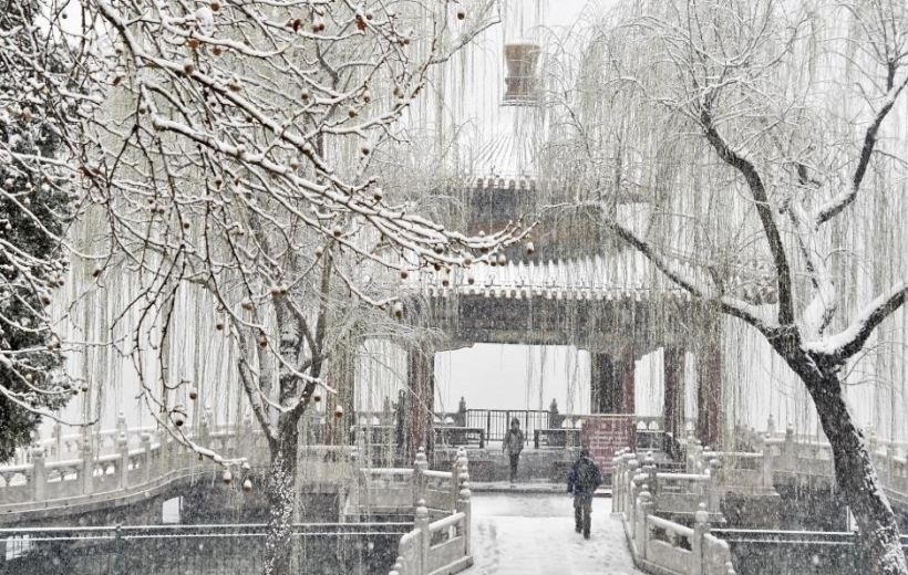 A citizen rides in snow in Beijing, capital of China