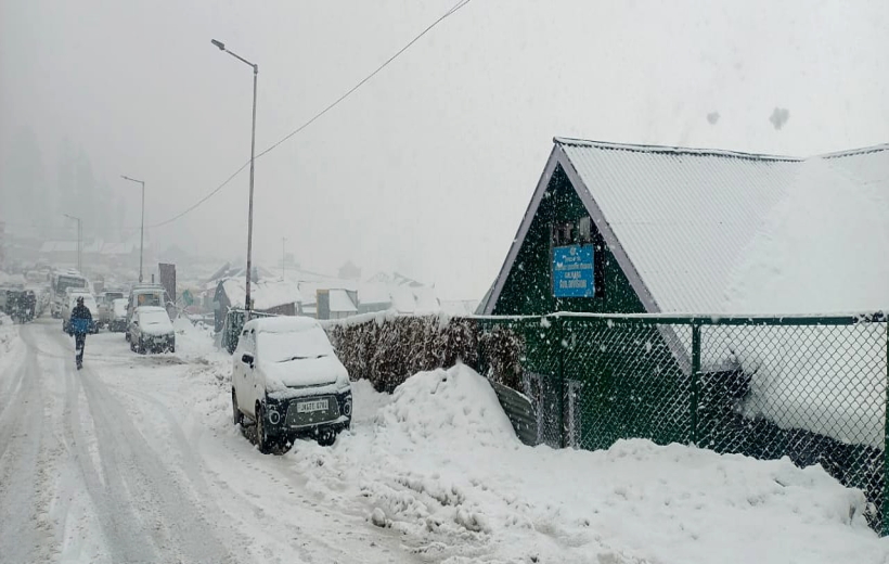 Gulmarg: A view of the area covered in thick blanket of snow during snowfall, in Gulmarg on Wednesday