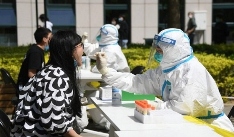 Residents queue up for nucleic acid testing at a COVID-19 test site in Dongcheng District of Beijing,