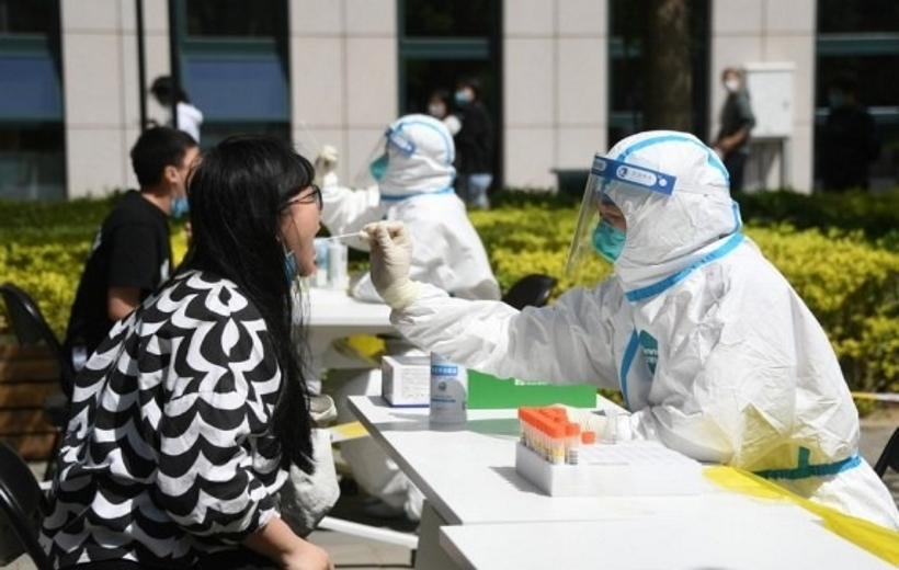 Residents queue up for nucleic acid testing at a COVID-19 test site in Dongcheng District of Beijing,