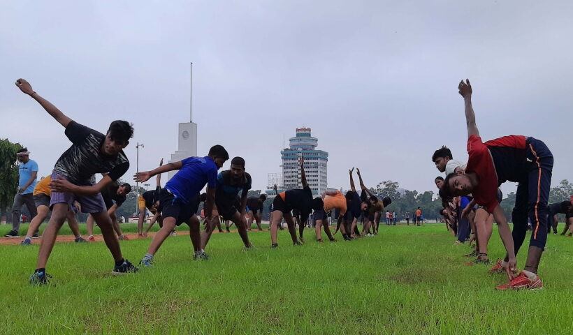 Youth during an exercise in Gandhi maidan after its gates opened for morning walkers after restrictions o