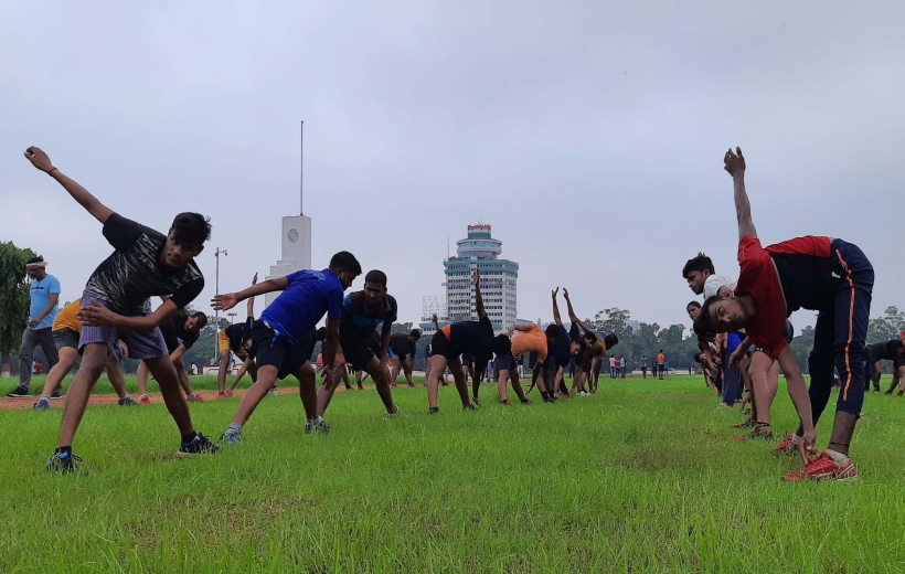 Youth during an exercise in Gandhi maidan after its gates opened for morning walkers after restrictions o