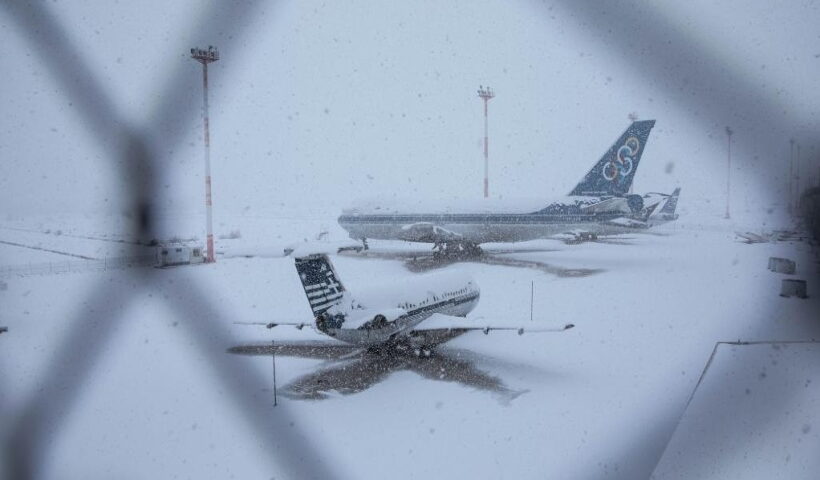 Airplanes at a former airport during heavy snowfall on Athens' southern coast, Greece. (Photo by Lefteris Partsalis/