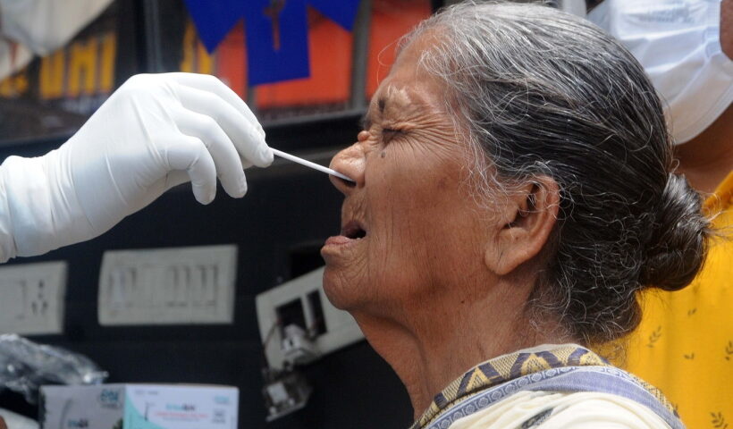 Kolkata: A health worker collects a nasal sample from an elderly woman for Covid-19 test amid the surge in coronavirus cases, in Kolkata on Monday