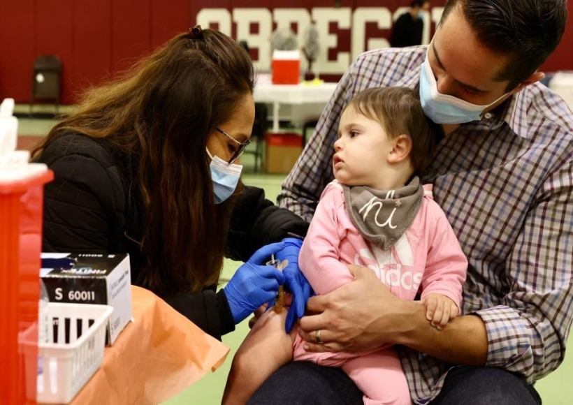 A child receives a COVID-19 vaccine shot in Los Angeles, the United States