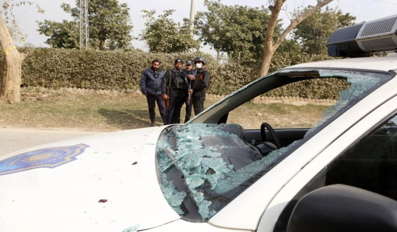 A police car is damaged in a suicide attack in Pakistan's capital Islamaba