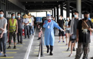 A volunteer works at a nucleic acid testing site in Sanya, south China's Hainan Province,