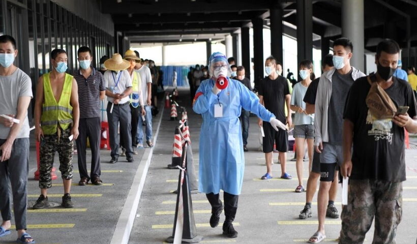 A volunteer works at a nucleic acid testing site in Sanya, south China's Hainan Province,