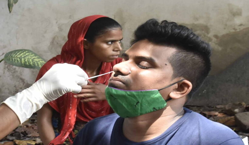 Patna: A health worker collects a nasal sample from a woman for the Covid-19 test amid surge in coronavirus cases, at New Gardiner Road Hospital in Patna on Wednesday,