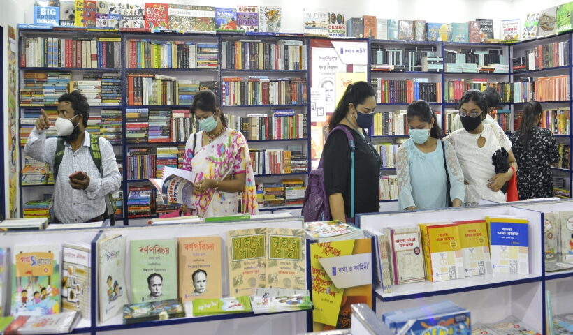 Kolkata : Visitors admire books at a stall during 45th International Kolkata Book Fair in Kolkata
