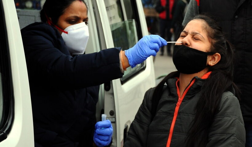 New Delhi:A health worker conduct random COVID-19 testing at Seelampur area as Coronavirus cases rise across the country in New Delhi