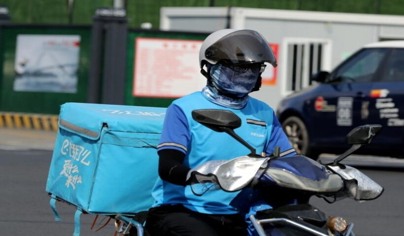 A deliveryman is seen on the street amid high temperature in Minhang District of east China's