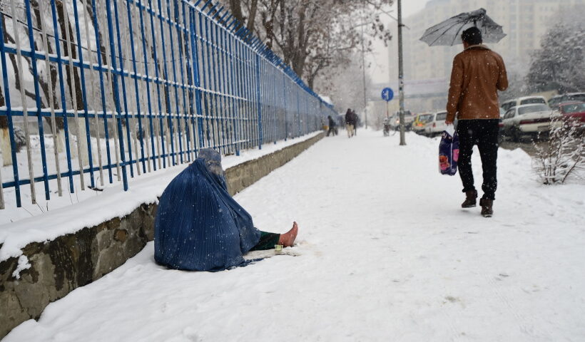 KABUL, Jan. 10, 2019 (Xinhua) -- A displaced person begs on a snow-covered road in Kabul, Afghanistan,